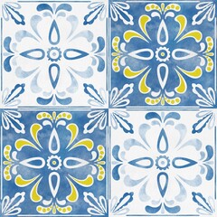 Fototapeta premium Decorative ceramic tiles showcase intricate floral designs in blue, white, and yellow, arranged in a symmetrical pattern suitable for various interior applications