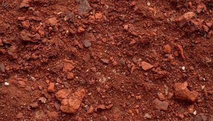 Red rocky soil texture with small stones and gravel