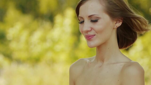 Young beautiful woman makes up mascara eyelashes