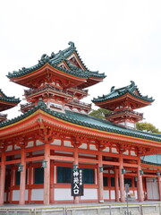 Fototapeta premium Traditional Japanese Temple with Multi‑Tiered Green Roofs and Red Wooden Columns