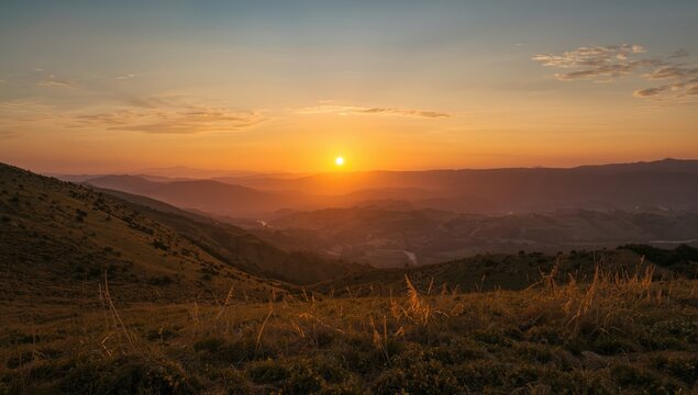 Sunset over rolling hills and valleys in the countryside