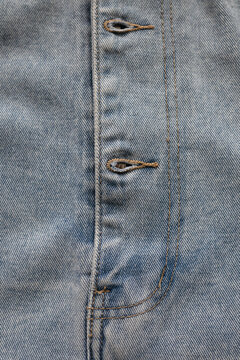 Row of buttons on denim closure