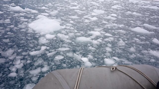 Boat Bow Crossing Brash Ice In Antarctic Waters