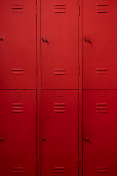 Industrial Red Metal Cabinet for Storage. Industrial Steel Cabinet in Bright Red Color. Red Metal Storage Cabinet Close Up.
