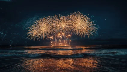 Luminous fireworks lighting the dark sky with sparkling ocean reflections © vxnaghiyev