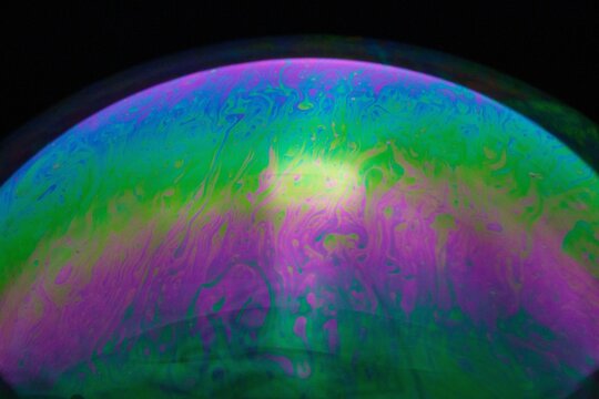 Abstract Macro Photography of an Iridescent Soap Bubble with Vibrant Colors