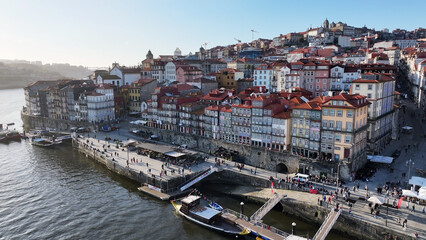 Fototapeta premium Ribeira Pier In Porto Portugal. Capturing The Hustle And Bustle Of A Vibrant City From Above. Industrial Skyline Skyscrapers Amazing. Industrial Cityscape. Porto Portugal.