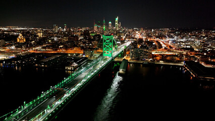 Fototapeta premium Benjamin Franklin Bridge In Philadelphia Pennsylvania United States. Elevated Road Bridge Symbol Of The City Viewed From Above. Night Highway Road Downtown Cityscape.