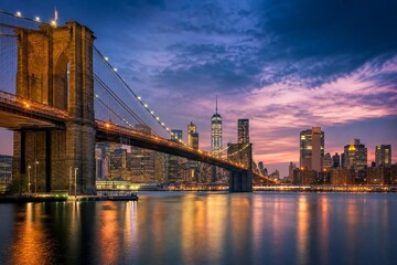 Fototapeta premium A city bridge at twilight, featuring warm lights and a dramatic skyline in an urban landscape.