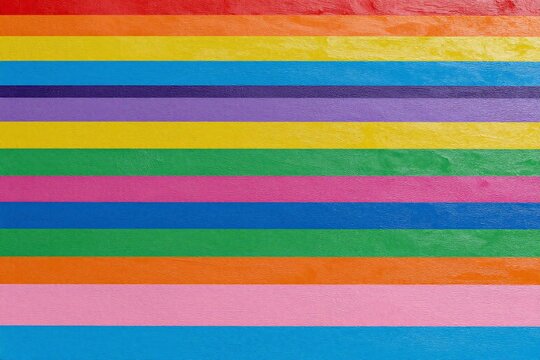 A close up of a colorful wooden fence. 