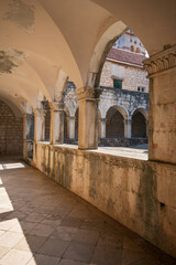 Fototapeta premium Cloister courtyard of the Franciscan monastery in Hvar, Croatia