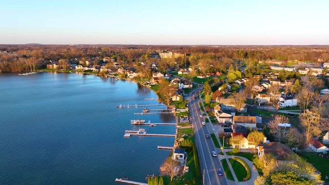 Waterfront residential houses aerial view in the morning on Walled Lake in city of Walled Lake, Michigan MI, USA. 