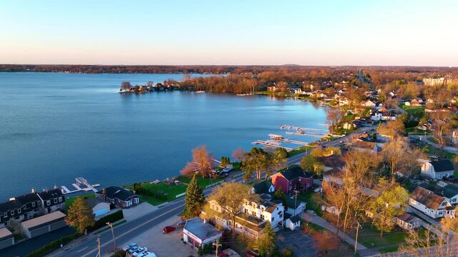Waterfront residential houses aerial view in the morning on Walled Lake in city of Walled Lake, Michigan MI, USA. 