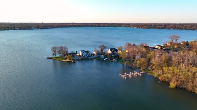 Waterfront residential houses aerial view in the morning on Walled Lake in city of Novi, Michigan MI, USA. 