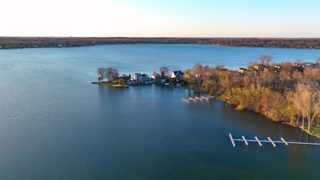 Waterfront residential houses aerial view in the morning on Walled Lake in city of Novi, Michigan MI, USA. 