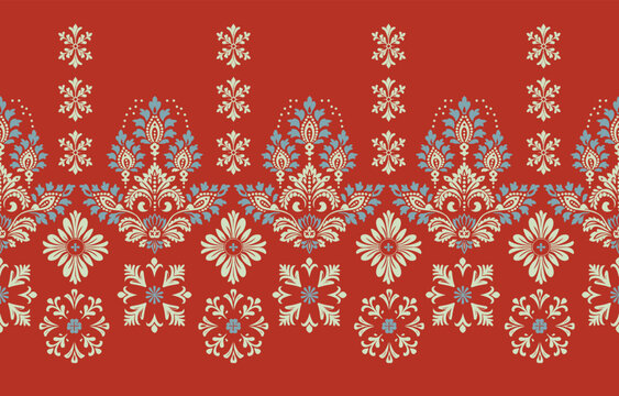 Traditional ethnic floral seamless border pattern with elegant damask and paisley motifs on a rich red background.