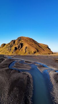 Vertical Aerial Flyover Towards Green Volcanic Mountain (Stora Dimon) in Iceland