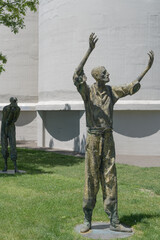 Obraz premium haunting bronze statue (The Jubilant Man) created by Irish sculptor Rowan Gillespie at Ireland Park, a powerful waterfront memorial at Éireann Quay, Toronto