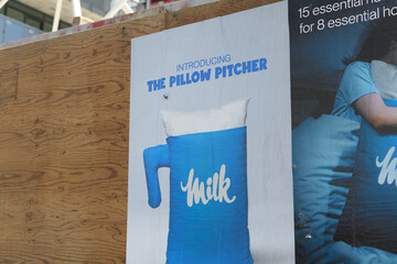 Obraz premium wheatpaste poster on plywood hoarding in Toronto (Milk, The Pillow Pitcher)