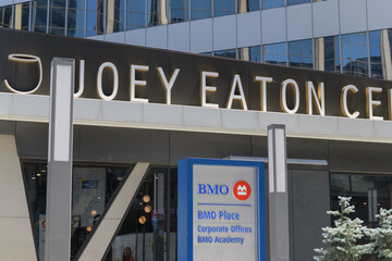 Obraz premium Joey Eaton Centre, a restaurant, and BMO Financial Group and corporate logo sign outside entrance to BMO Place at CF Toronto Eaton Centre located at 33 Dundas St W