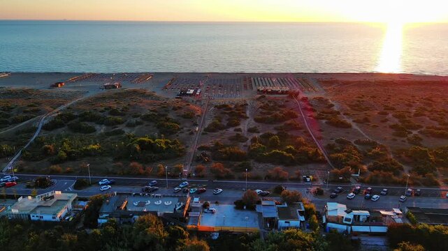 Beautiful Sunset Over Coastal Beach with Resorts and Ocean