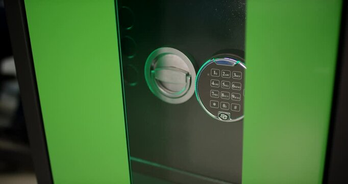 High security safe door with a digital keypad code lock and round turning handle dial