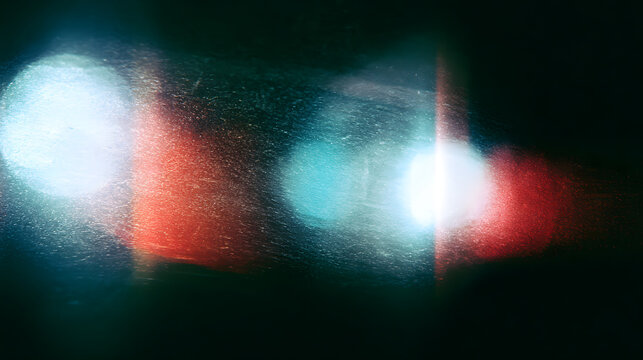 Cinematic film grain texture with soft light leaks, vintage analog photography aesthetic on a dark background, grainy noise overlay for retro video editing and nostalgic creative design work.