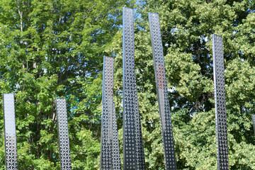 Obraz premium “Notre Place” – Monument to Franco-Ontarians, featuring tall stainless steel vertical staves with flag color and pattern, College St / University Av, Queen's Park edge, Toronto