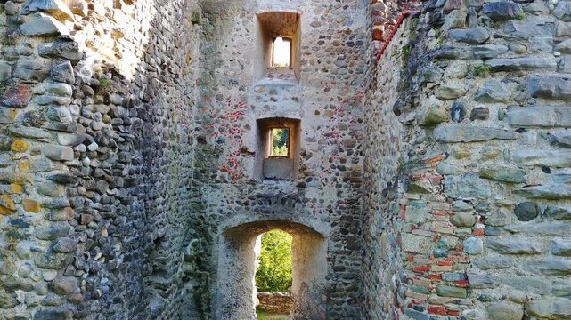 Drone Reveal of Ancient Stone Castle Ruins in Forest