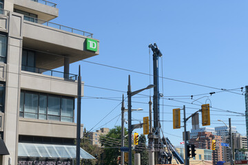 Obraz premium TD bank branch sign at 834–870 St Clair Ave W, Toronto (looking northeast at corner of St Clair and Bathurst St)