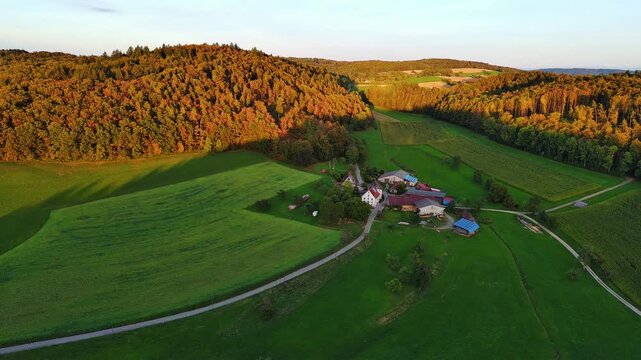 Aerial Drone View of Rural Village and Autumn Forests at Sunset