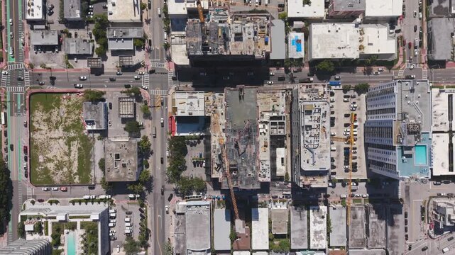 Top down aerial view of a building construction site with rebar and scaffolding