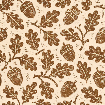 Simple seamless acorn and oak leaf linocut pattern in warm brown ink on cream textured paper
