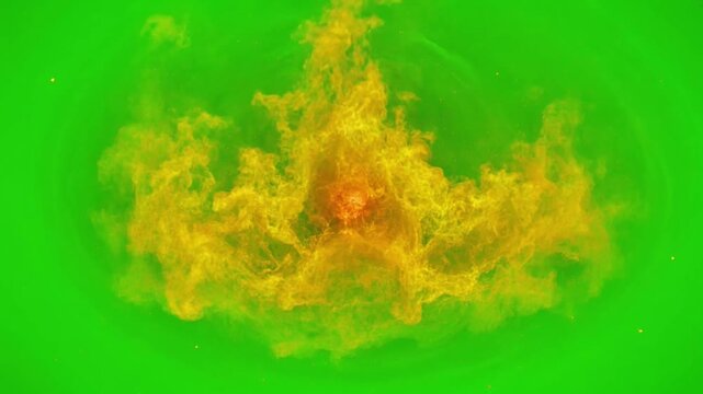 Fiery orange explosion burst isolated on green screen fire energy blast impact