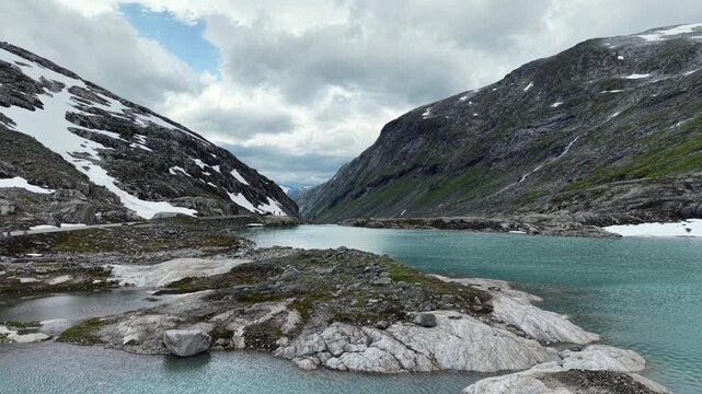 Aerial view of the glacial lake source near Videfossen in early summer, Norway.