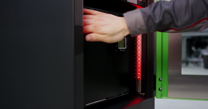 Electronic digital keypad lock device mounted on a green security safe box door panel