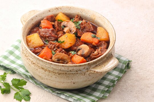 Classic French Beef Bourguignon, a rich and hearty slow-cooked beef stew made with tender beef, red wine, mushrooms, carrots, onions, and fresh herbs
