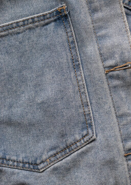 Close-up of denim jacket pocket stitching