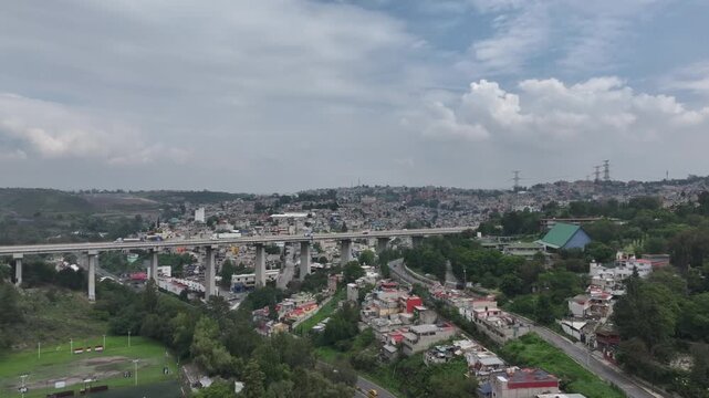 Aerial panoramic view over Panoramic Cityscape and Highway Bridge in Atizap&aacute;n, Estado de M&eacute;xico