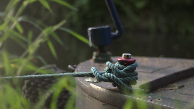 Boat tied with a rope on moorings 