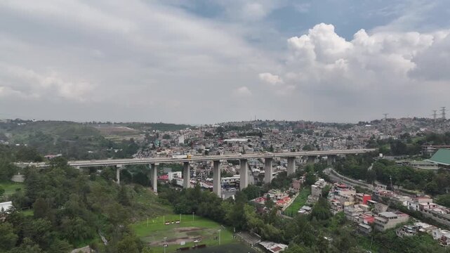Drone Ascends Vertically Revealing Panoramic Blue Sky View of Atizap&aacute;n, Estado de M&eacute;xico
