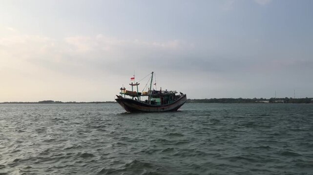 A fishing boat is moving
