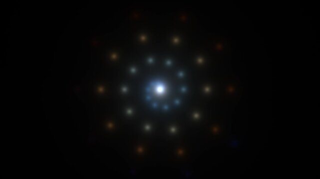 A spiral design made of bright points appears in a dark space