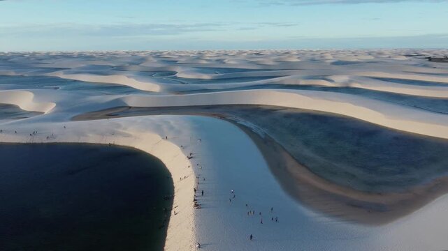 Golden hour aerial panorama of Len&ccedil;&oacute;is Maranhenses lagoons Brazil