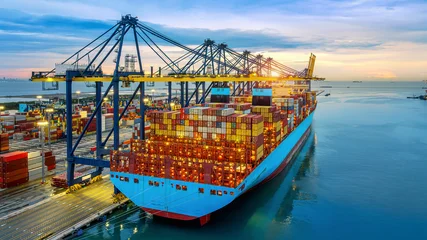 Aerial shots of Container ship loading and unloading in port. © tawatchai1990