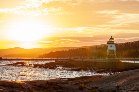 Lighthouse at the bay entrance in Grand Marais Minnesota at sundown during the fall