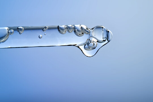 Skincare serum dropper with hydrating hyaluronic acid liquid