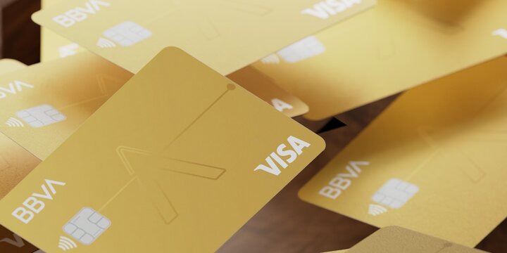gold bbva visa credit cards in a pile