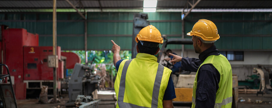 Workers Factory or Engineering work at factory site check up machine or products in site. Foreman or Technician checking Material or Machine on Plant. Heavy industry factory concept.