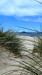 Obraz premium Ilot Saint-Michel at low tide with Chapel of Saint-Michel in the distance, Erquy, Brittany, France. 